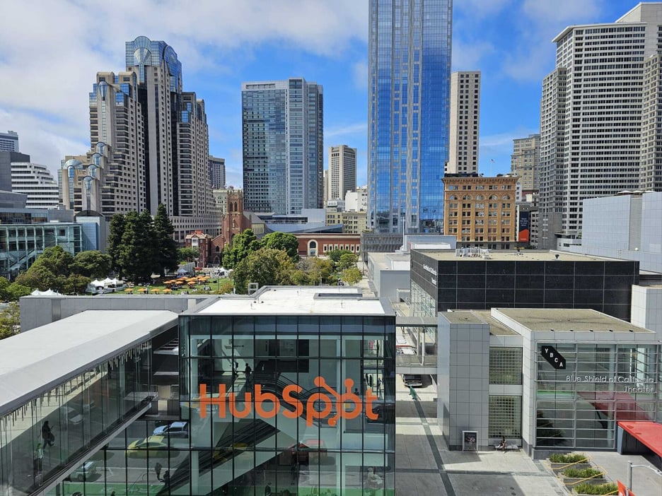 HubSpot logo on an office building against the San Francisco skyline
